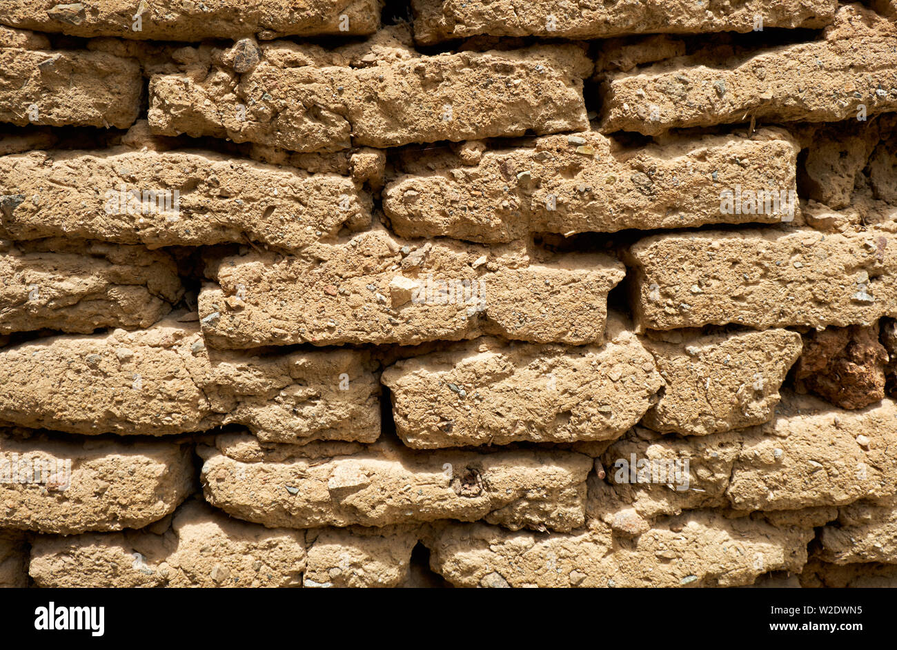 Background of old wall made of adobe or mudbrick masonry. Stock Photo