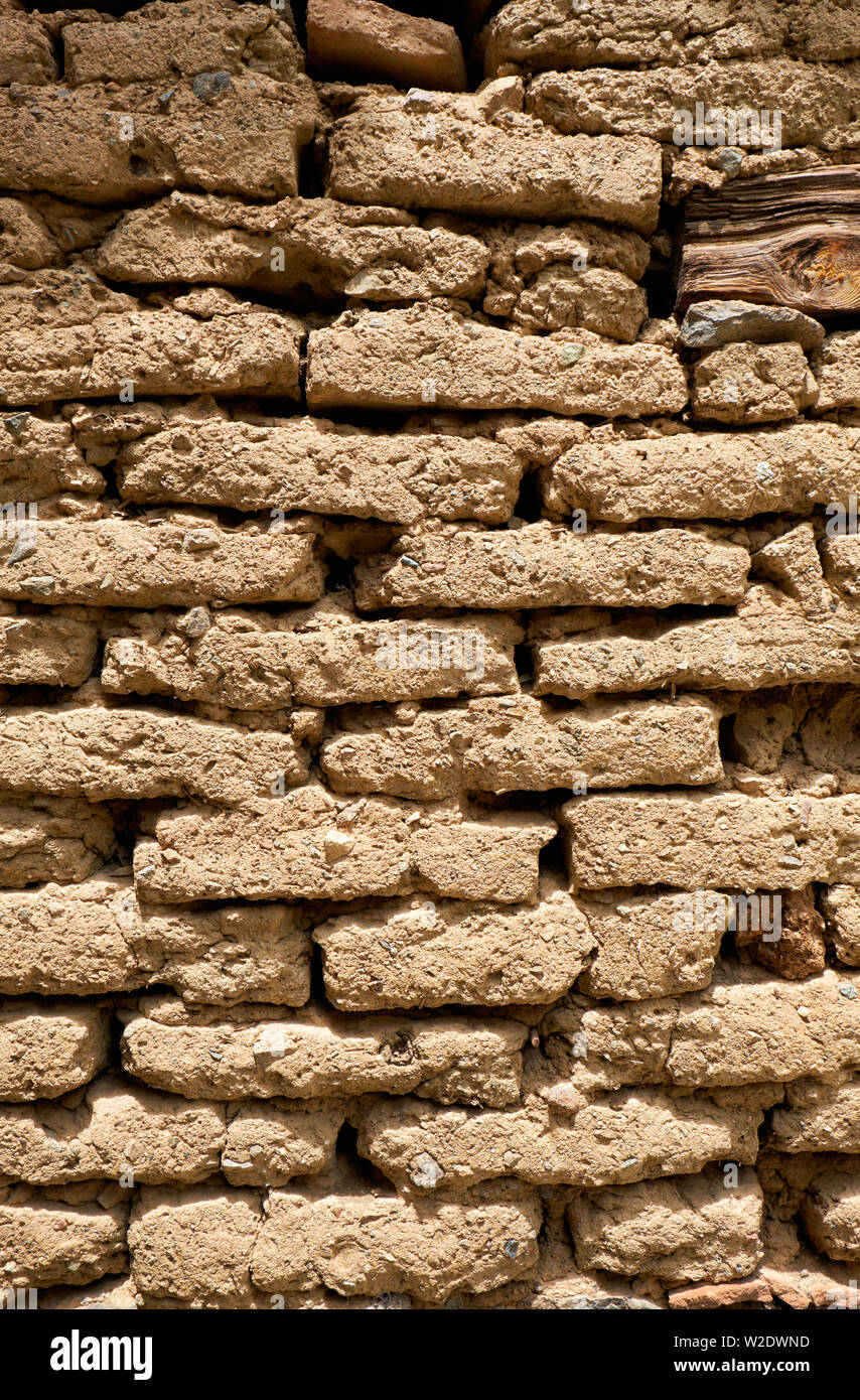Background of old wall made of adobe or mudbrick masonry. Stock Photo