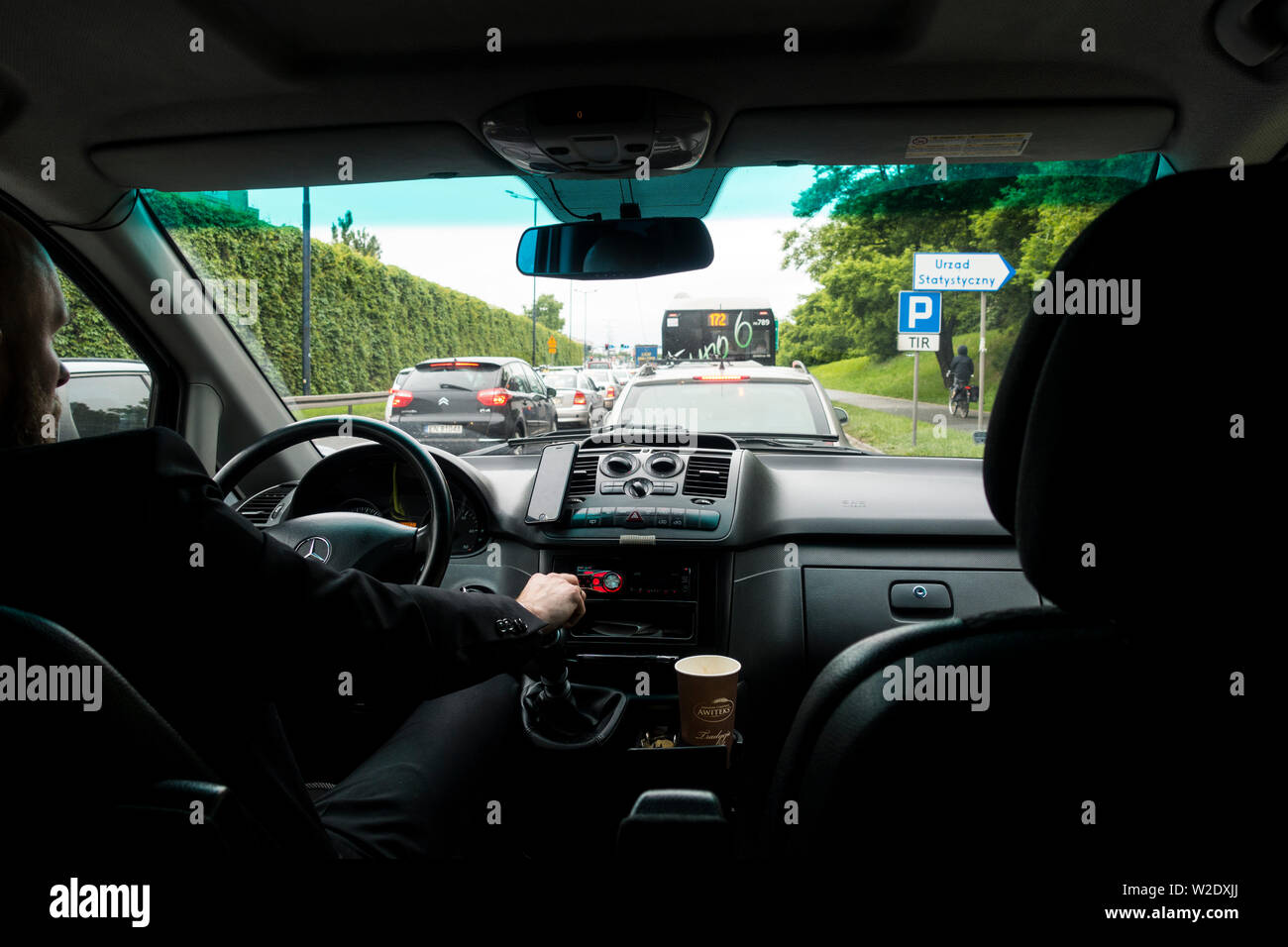 Polish Taxi driver doing the airport run in busy traffic,Krakow, Poland