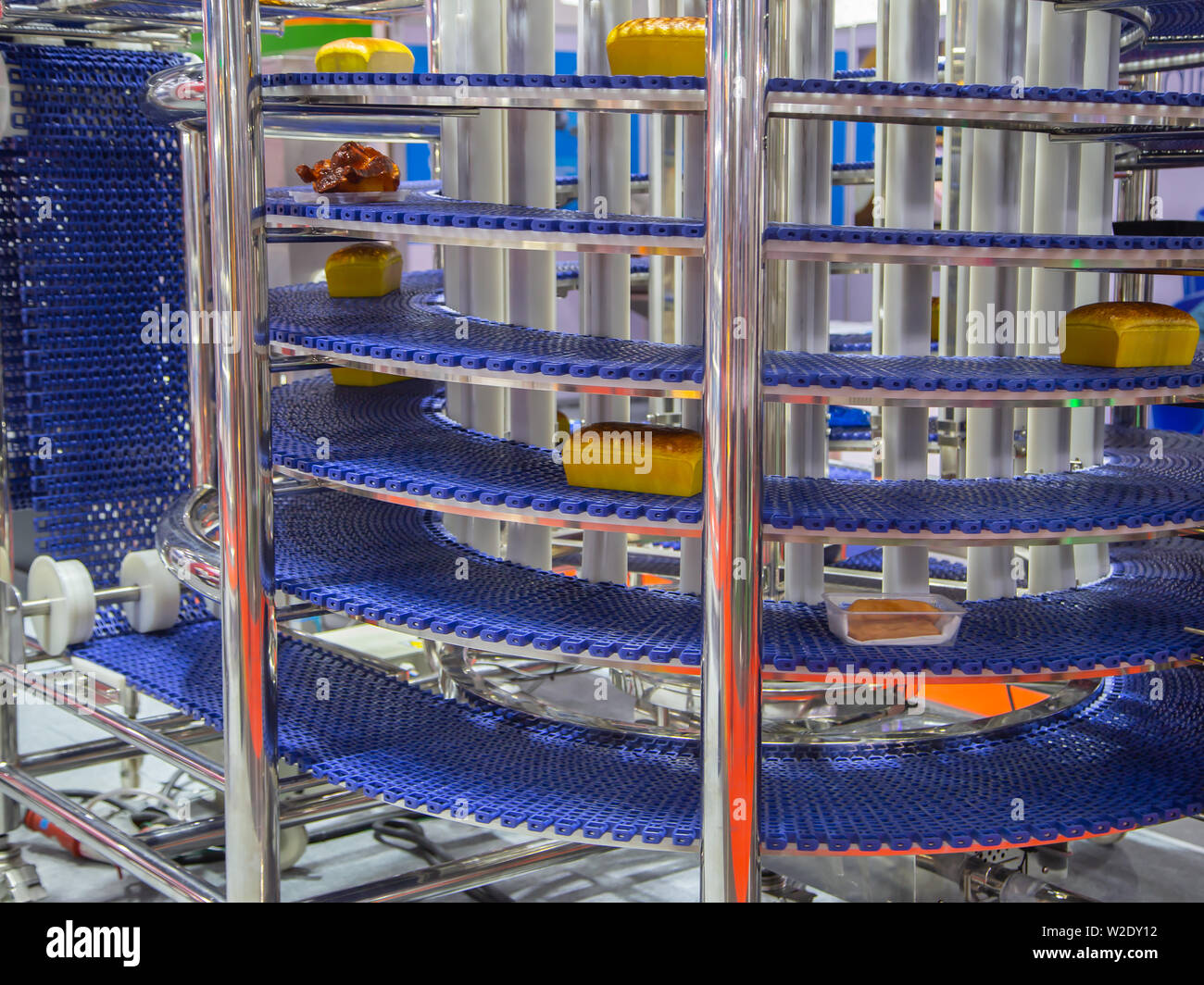Food on automatic conveyor belt in food industry Stock Photo Alamy
