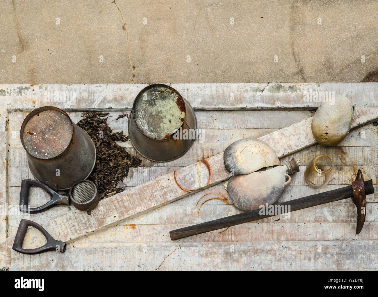 old rusty archeology tools display on board Stock Photo