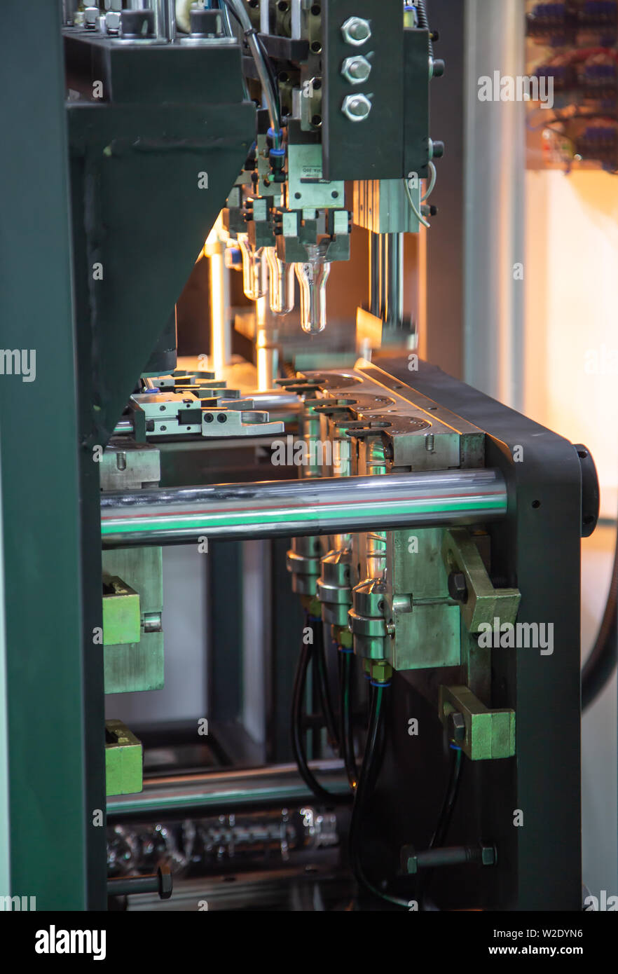 Process of PET plastic bottle on plastic Bottle blowing machine Stock Photo