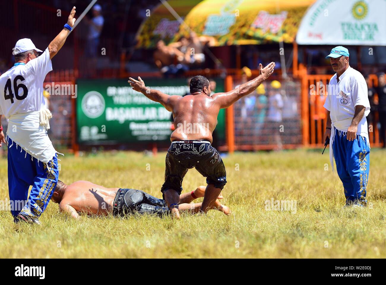 Ankara, Turkey. 7th July, 2019. Wrestlers are seen during the traditional Kirkpinar Oil Wrestling Festival in Edirne, Turkey, July 7, 2019. Turkey's Kirkpinar Oil Wrestling Festival is a centuries-old traditional sport event, in which sportsmen covered with olive oil compete to win a prestigious golden belt. TO GO WITH Feature: Turkey braces for major traditional oil wrestling tournament. Credit: Ihlas News Agency/Xinhua/Alamy Live News Stock Photo