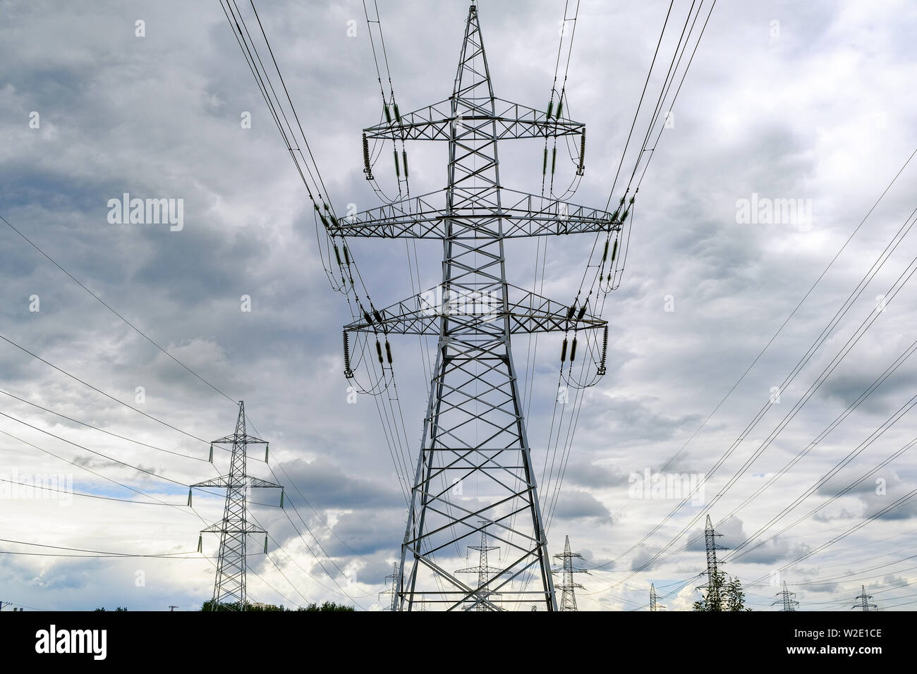 High-voltage power lines. Cloudy sky before a thunderstorm Stock Photo ...