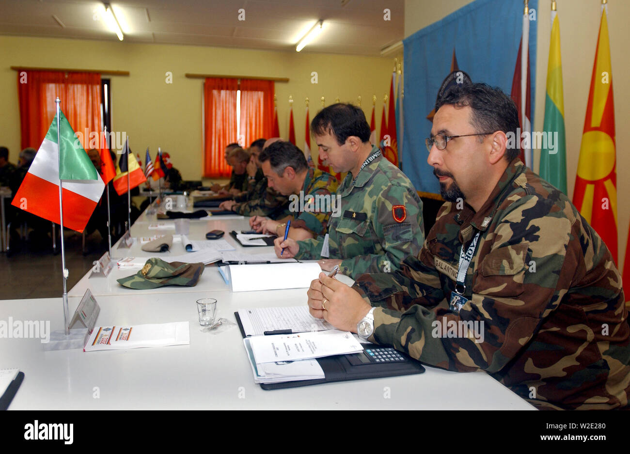 The Spanish Army Delegation Chief (foreground) waits for the morning technical briefing in the conference hall at Lager Aulenbach, Germany, during the US European Command (USEUCOM) -sponsored Exercise COMBINED ENDEAVOR. Stock Photo