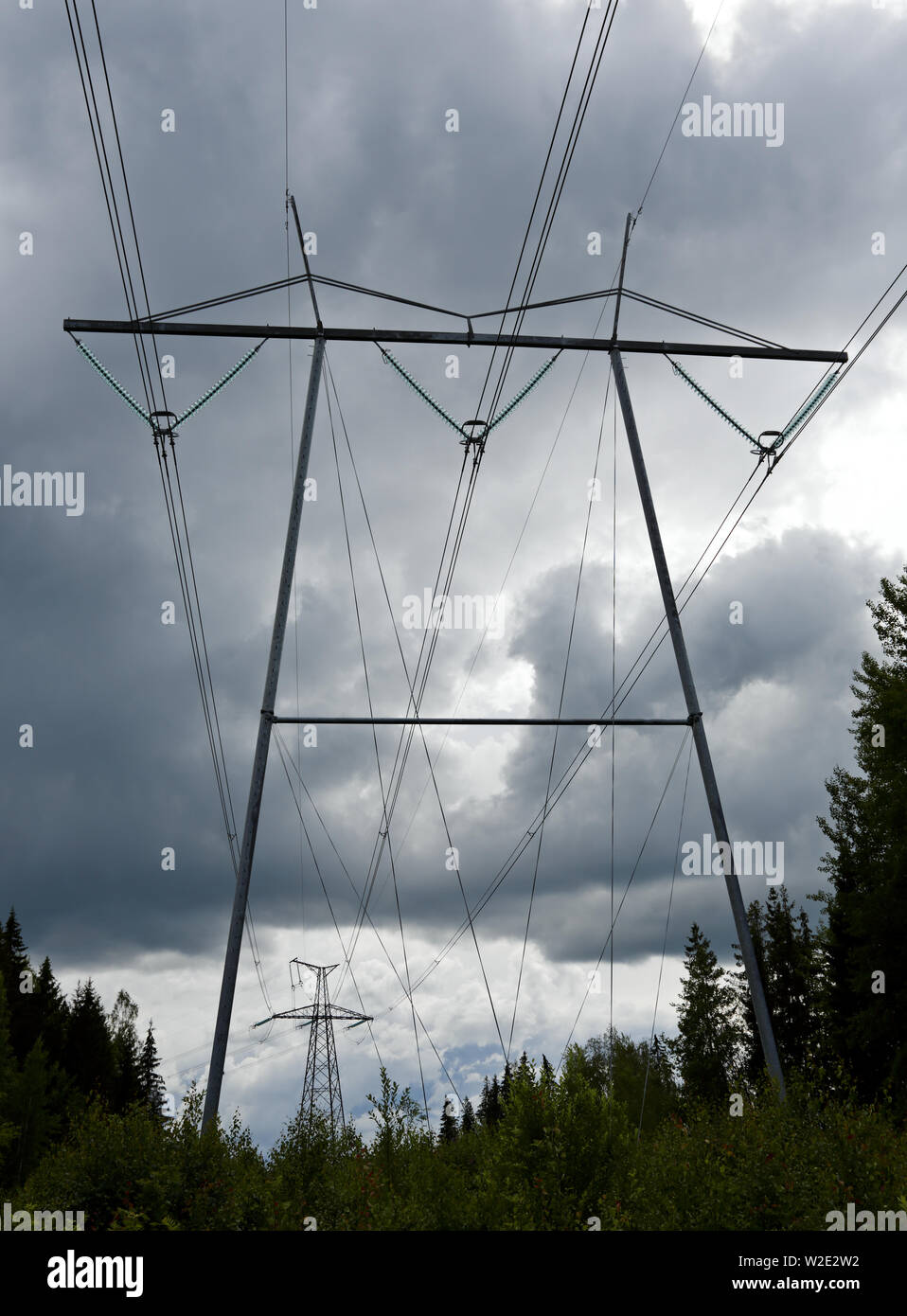 Power line against stormy and grey clouds in the sky Stock Photo - Alamy