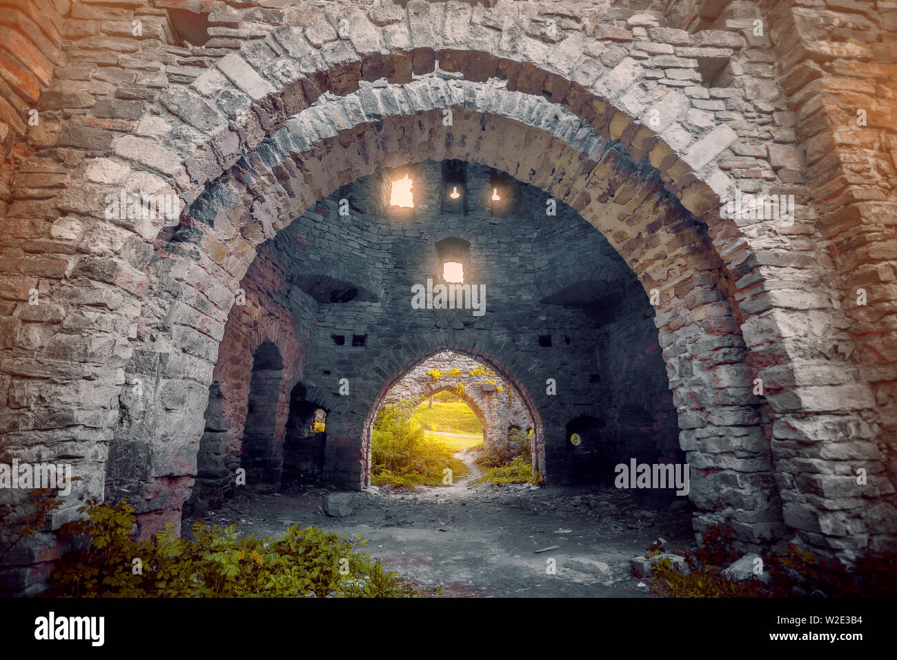 Ancient stone walls with arches and windows Stock Photo