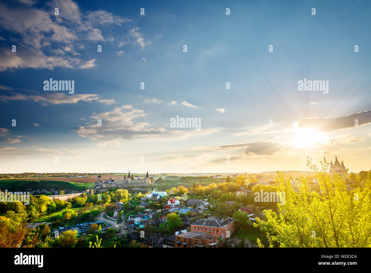 Kamianets Podilskyi cityscape under sunshine and colorful sky Stock Photo