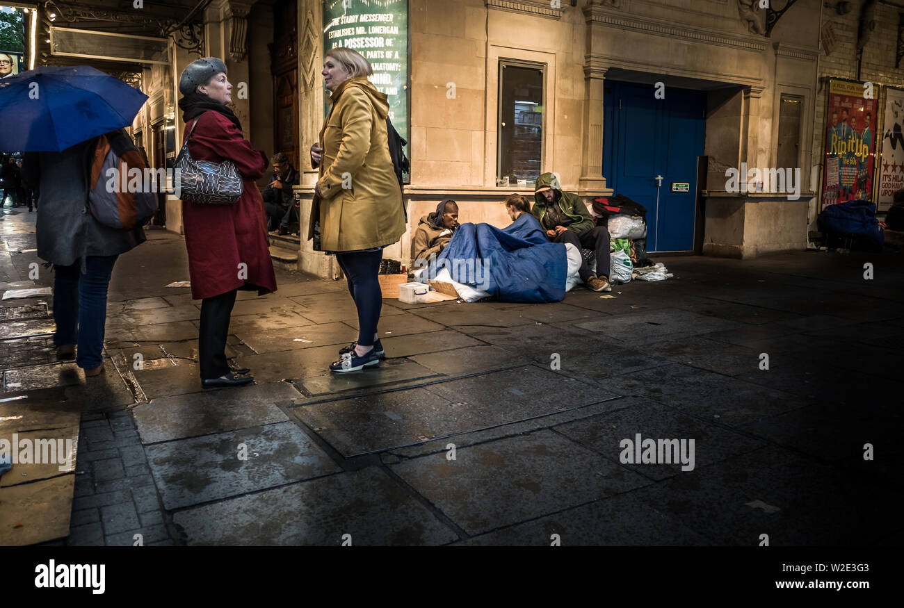London, Uk  - May 9th 2019: Homeless people sleeping on the streets of London's West End ignored by passers by. Stock Photo