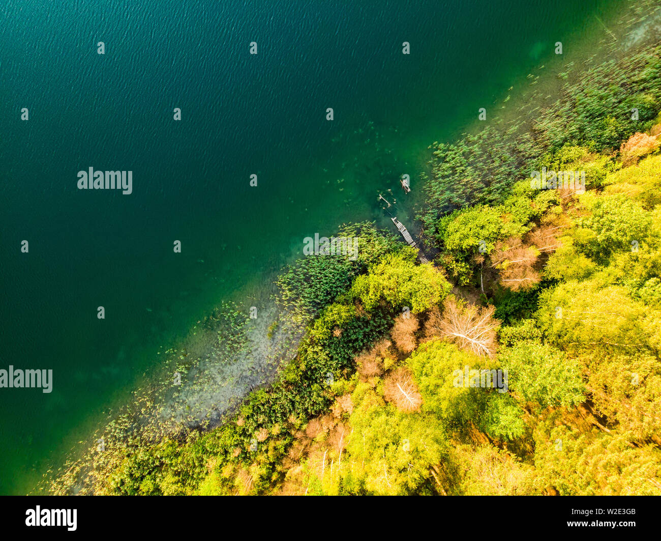 Aerial top down view of beautiful green waters of lake Gela. Birds eye ...