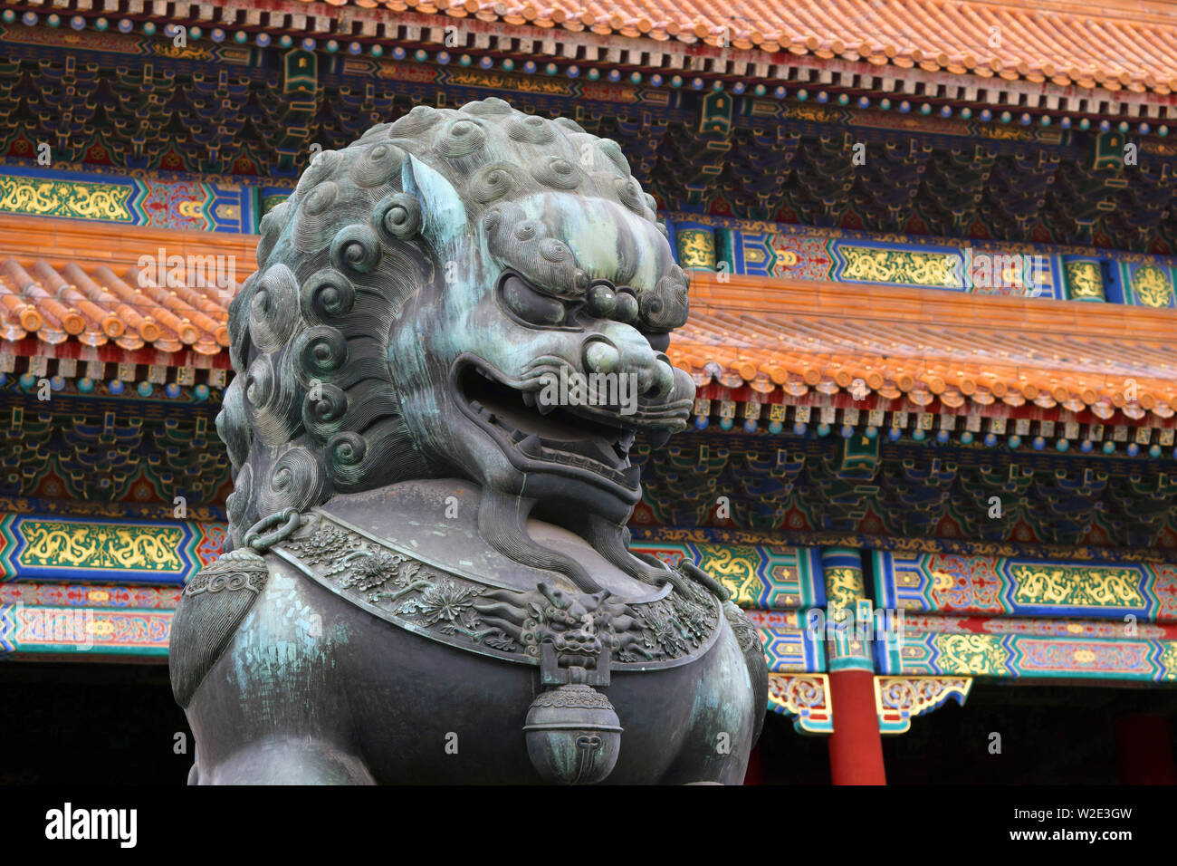 Statue of a bronze lion inside the forbidden city in Beijing, China. An ancient Historical Famous Building. Stock Photo