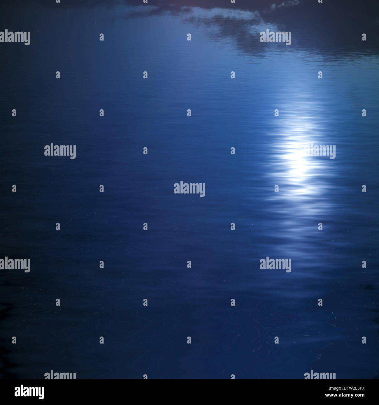 natural landscape with night sky and moon reflected in water Stock Photo
