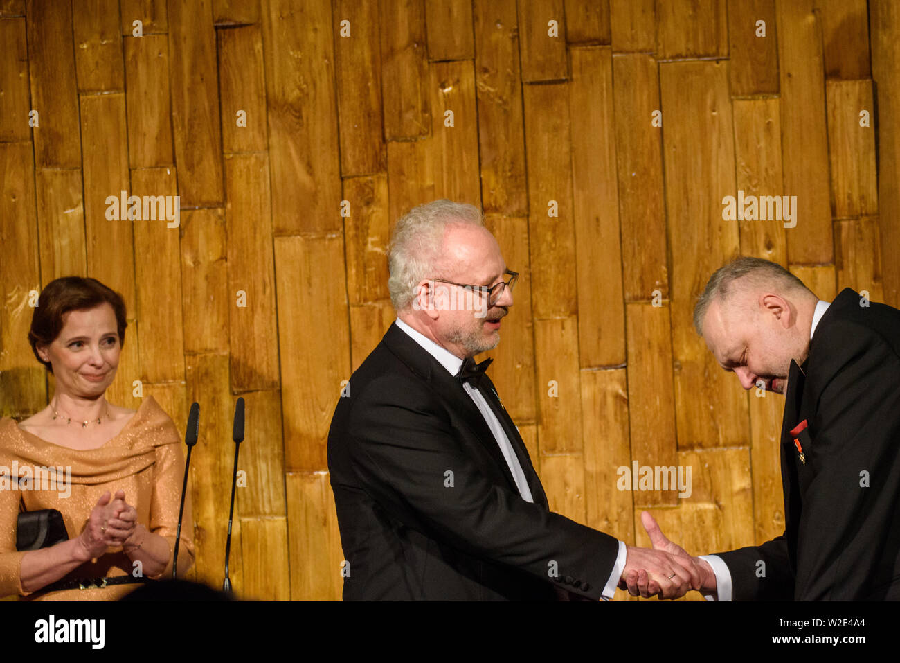 Riga, Latvia. 8th July 2019. Egils Levits giving gift for Andris Vilks, director of LNB (Latvian National Library), during Reception in honour of the inauguration of President of Latvia Mr Egils Levits accompanied by First Lady of Latvia Mrs Andra Levite. Credit: Gints Ivuskans/Alamy Live News Stock Photo