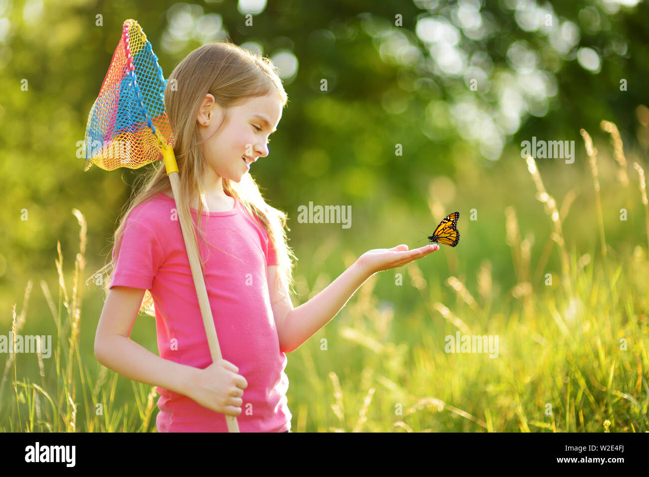 Little girl butterfly net hi-res stock photography and images - Alamy