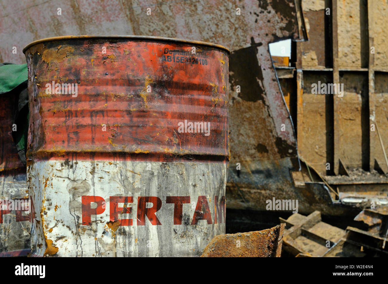 madura island, jawa timur / indonesia - may 10, 2010: an old weathered pertamina oild drum at a ship scrapping yard at the madury southern coast Stock Photo