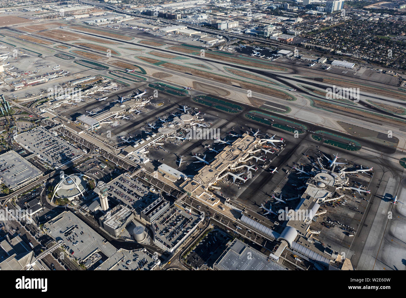 Los Angeles, California, USA - August 16, 2016:  Afternoon aerial view of busy LAX Airport terminals and south runways. Stock Photo
