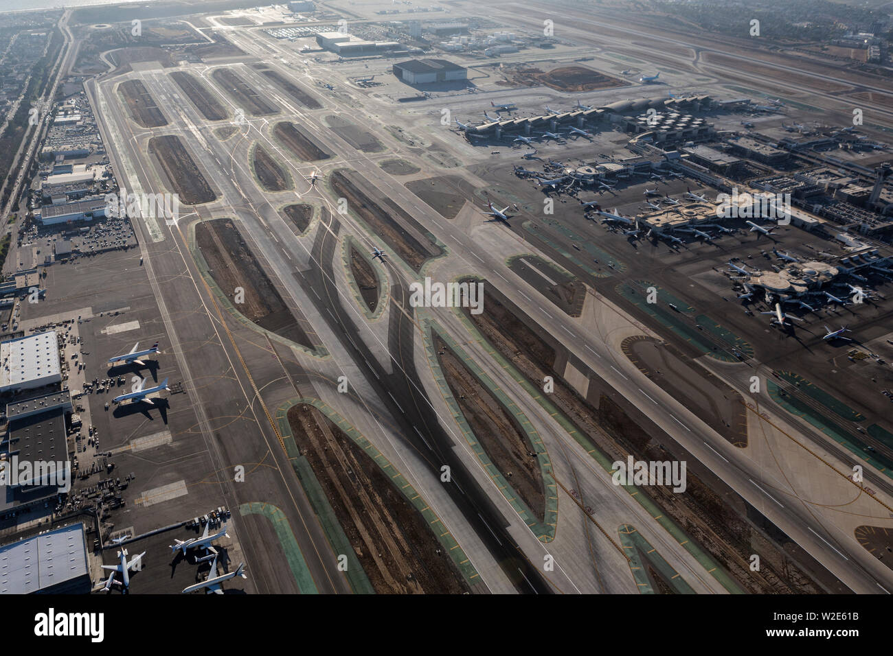 Los Angeles, California, USA - August 16, 2016:  Aerial view of runway and terminals at LAX airport in Southern California. Stock Photo