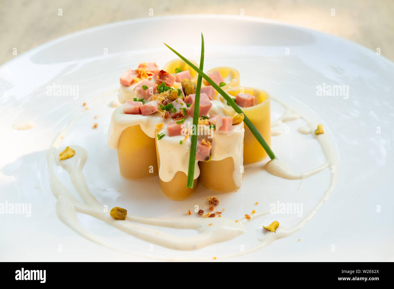 Paccheri Italian fresh traditional pasta with mortadella bologna ham