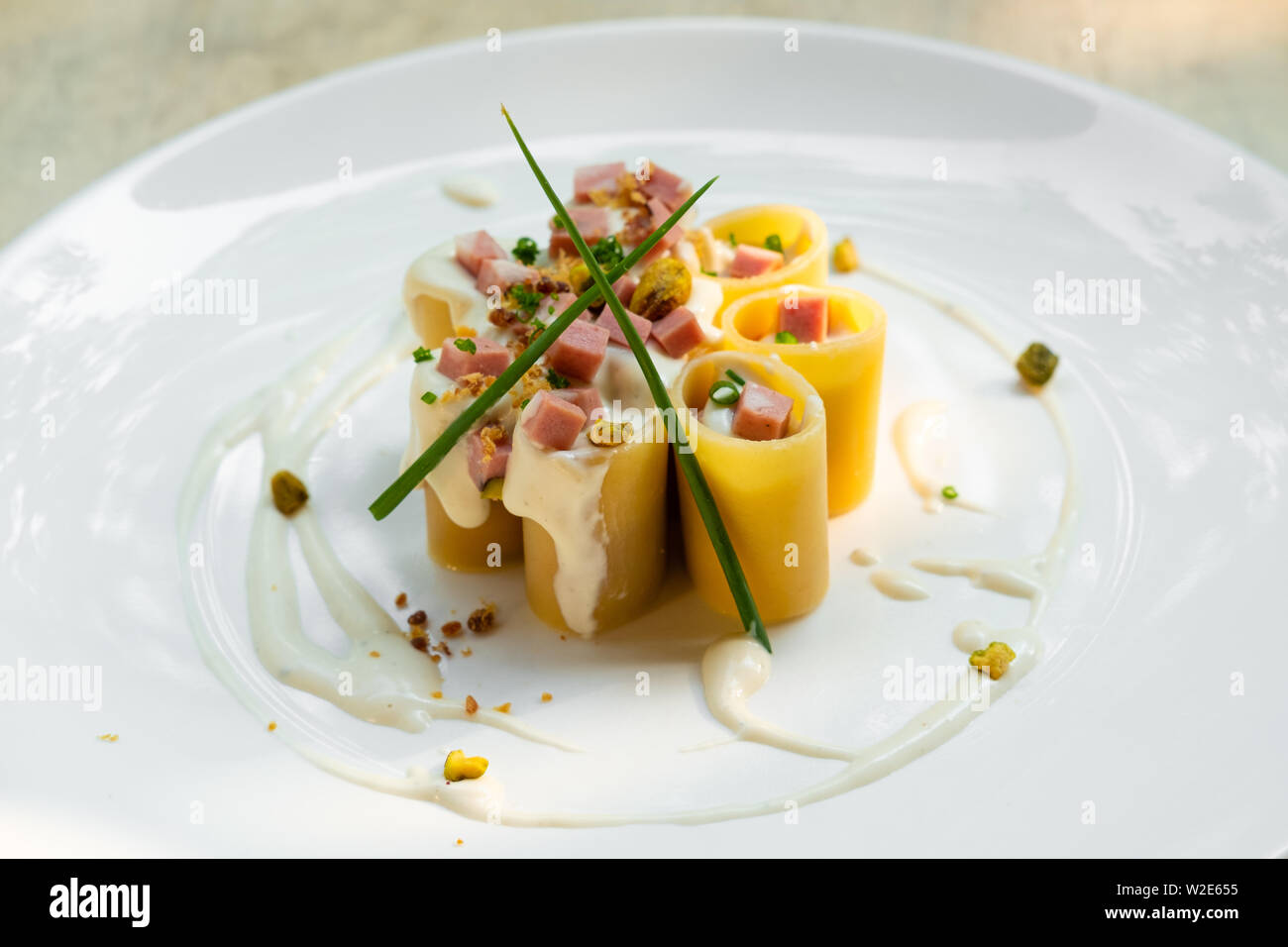 Paccheri Italian fresh traditional pasta with mortadella bologna ham