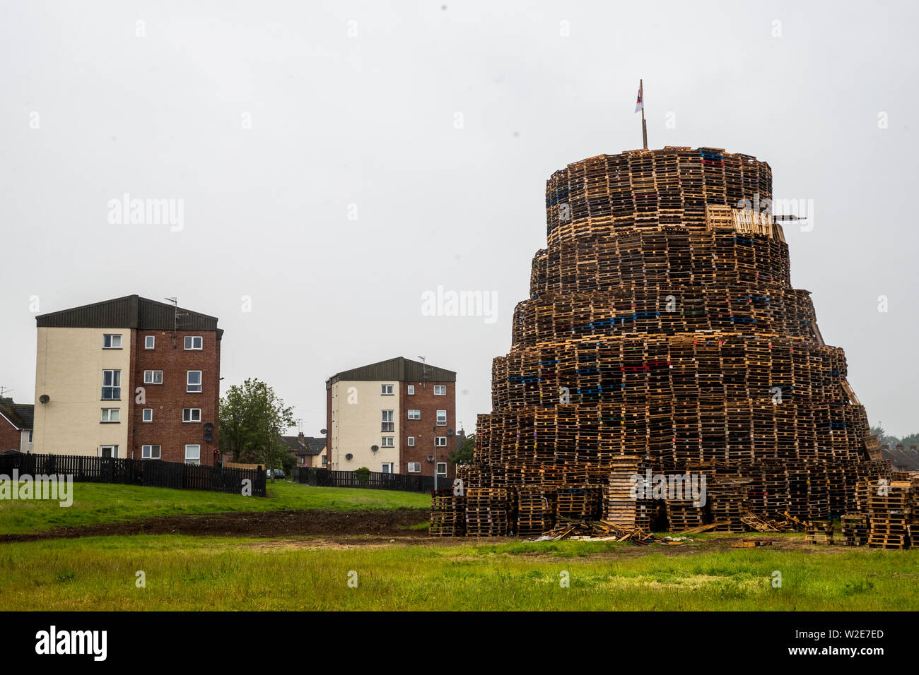 Loyalists in the Redmanville area of Portadown continue to build their traditional 11th night bonfire as part of the 12th of July celebrations. Residents in nearby flats received a letter from the South Ulster Housing Association (SUHA) advising them that the bonfire poses a serious health and safety risk, with a risk to damage of occupants property, and were offered alternative accommodation for a night in the Armagh City Youth Hostel. Stock Photo