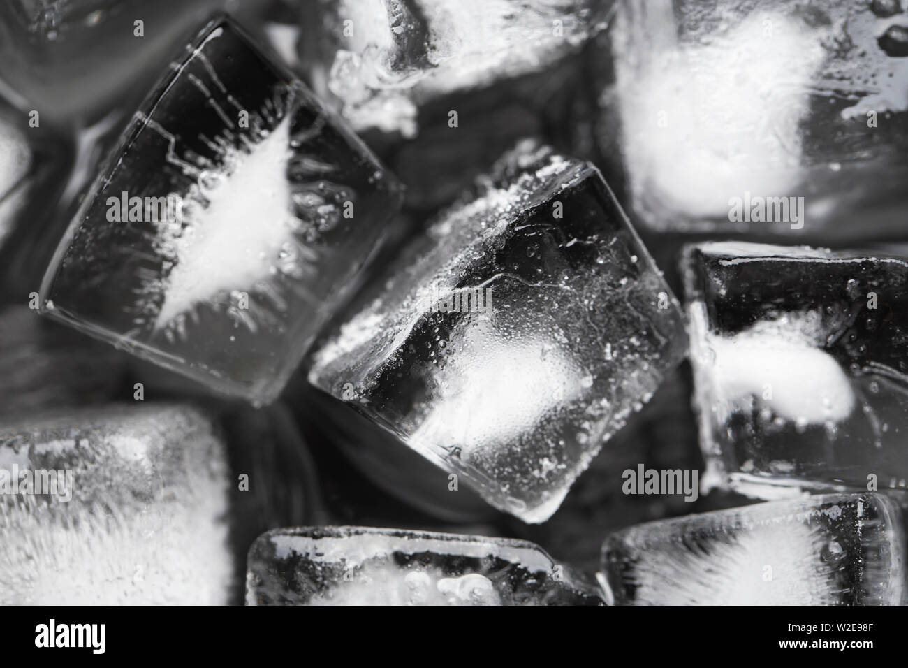 Ice cubes on a black background. View from above Stock Photo - Alamy