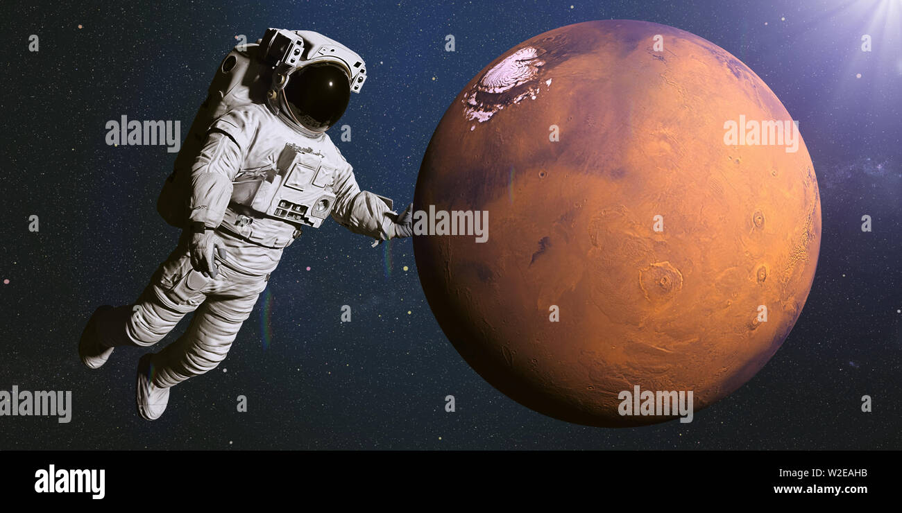 astronaut holding the red planet Mars  (3d illustration, elements of this image are furnished by NASA) Stock Photo