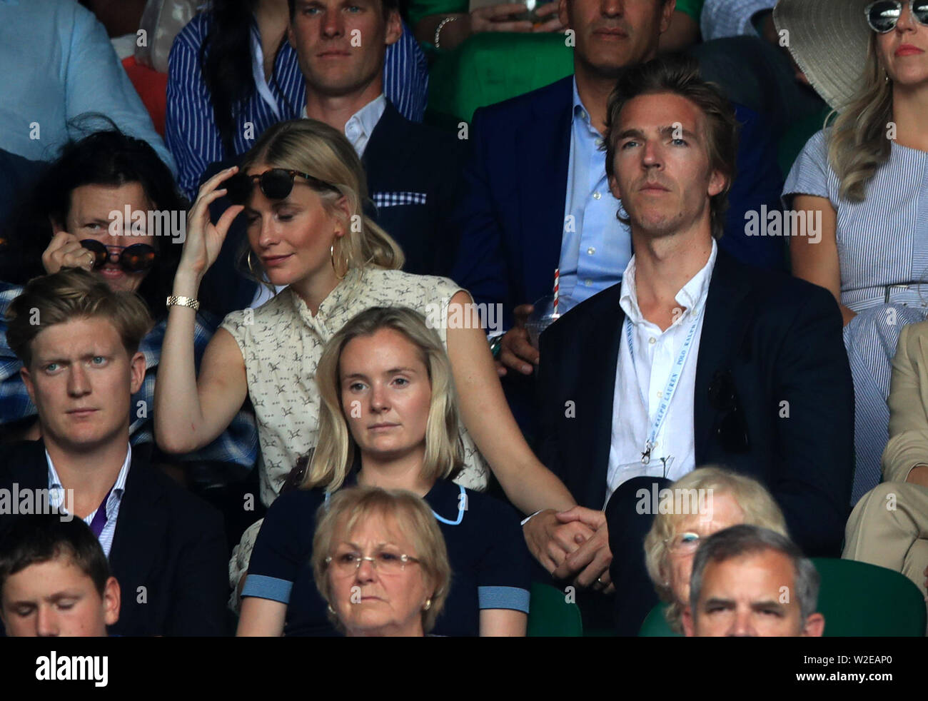 Poppy Delevingne and James Cook on day seven of the Wimbledon Championships at the All England Lawn Tennis and Croquet Club, Wimbledon. Stock Photo