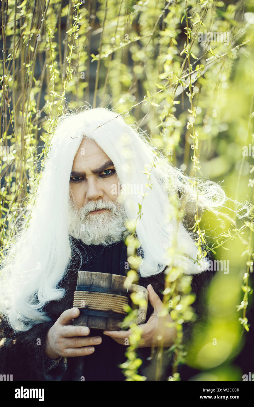 Druid Old Man With Long Grey Hair And Beard On Serious Face With