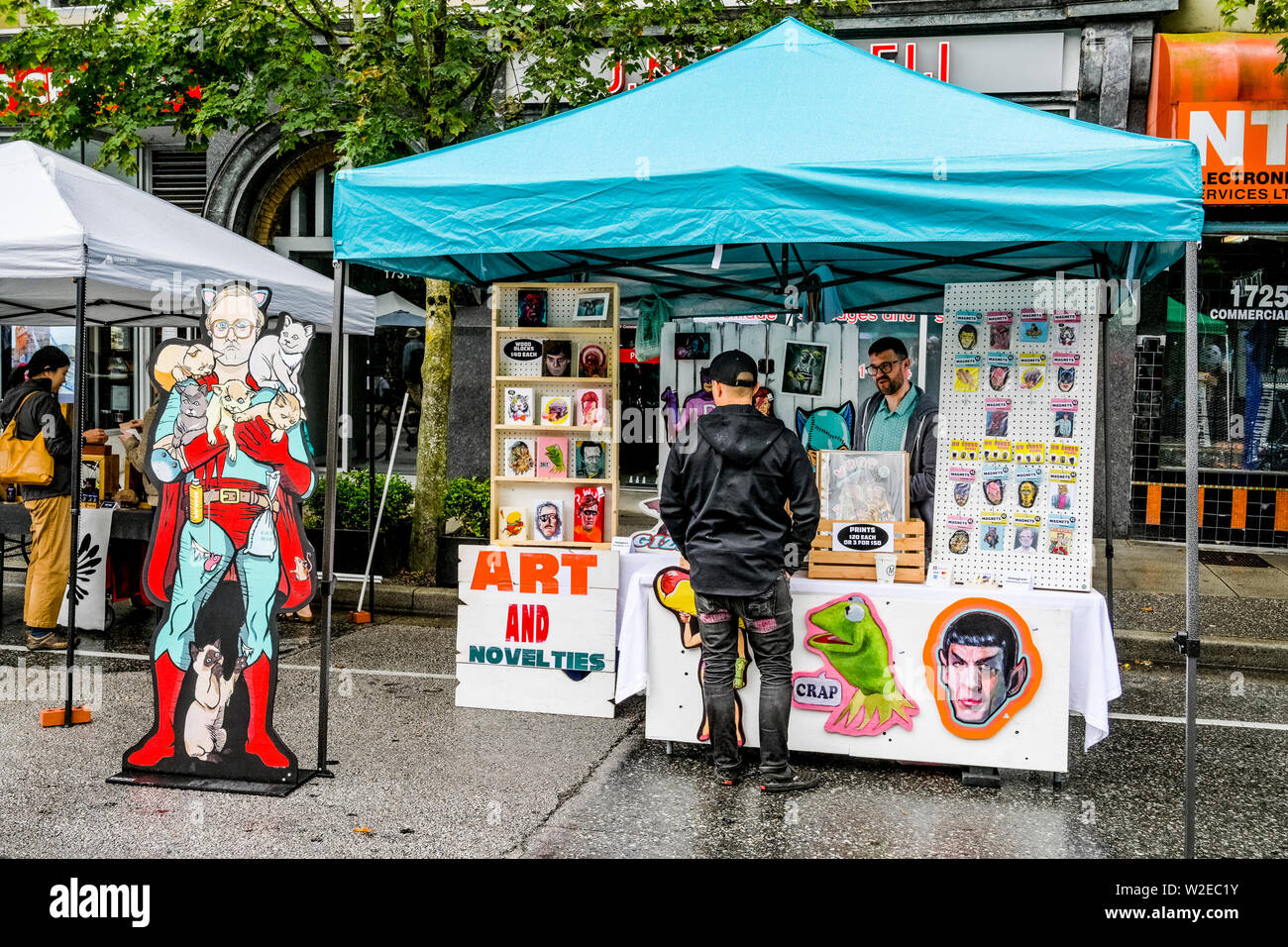 Artist MW Bowen Art booth, Car Free Day, Commercial Drive, Vancouver, British Columbia, Canada Stock Photo