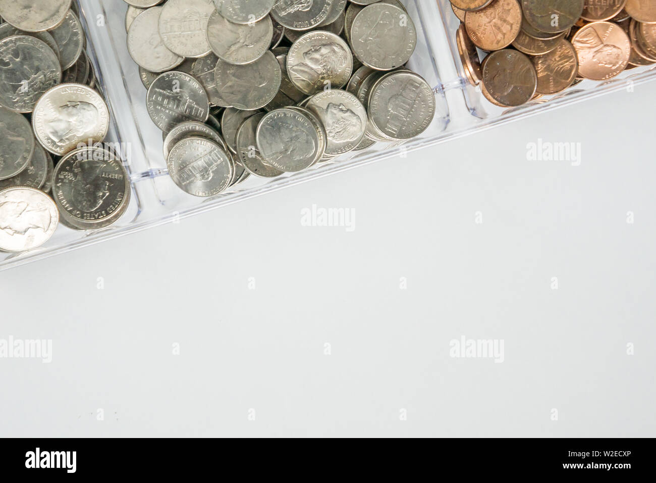 Isolated organized loose coin change on top side, white background, blank empty room space for copy or text on bottom. Financial organization money co Stock Photo