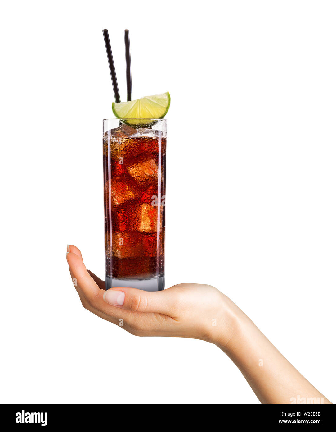 Woman hand holding cocktail in tall glass on white background Stock ...