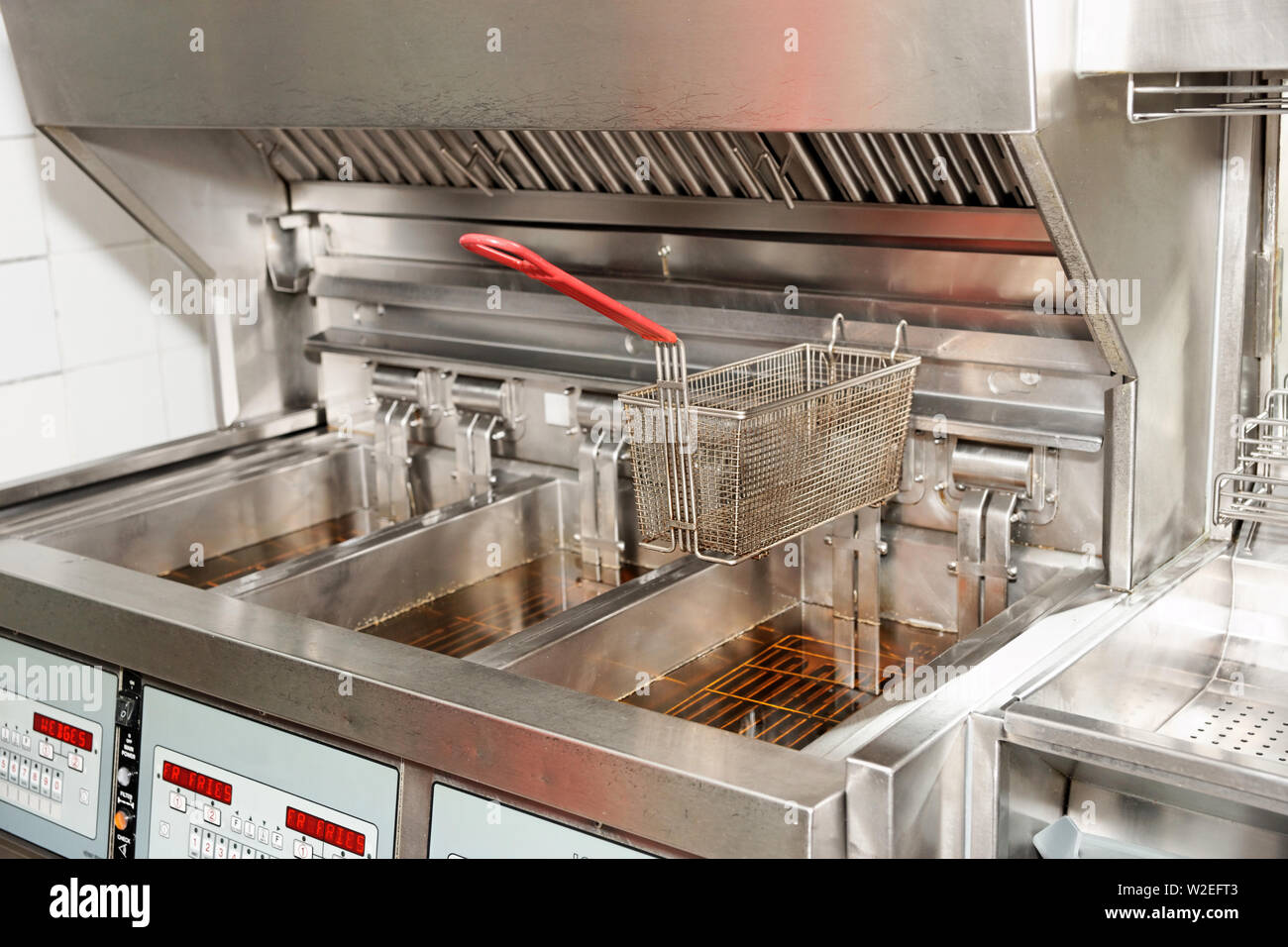 Deep fryer with oil on restaurant kitchen Stock Photo Alamy