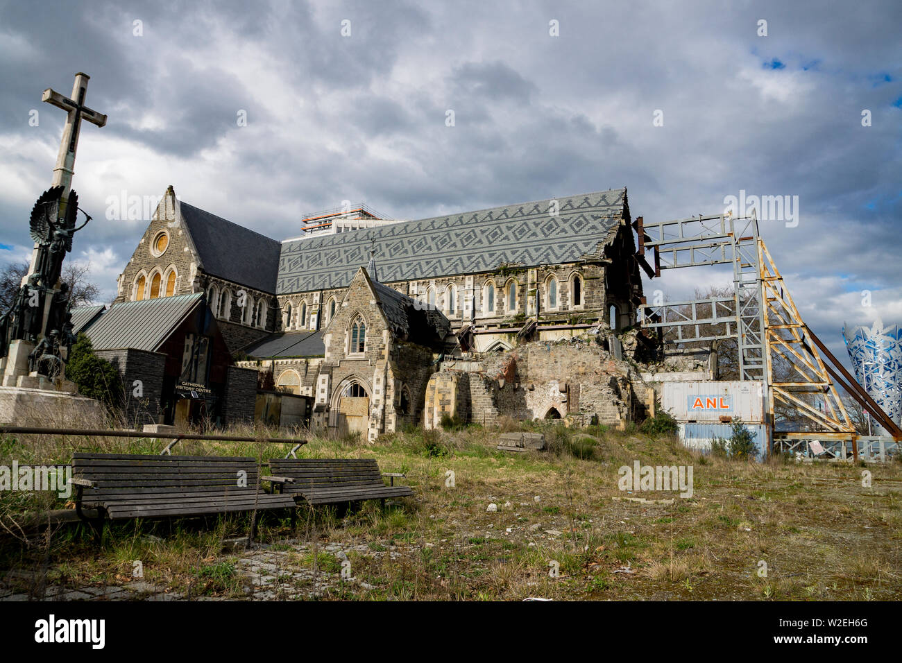 Ruins of Christchurch cathedral, New Zealand, supported by steel buttress, under cloudy sky Stock Photo