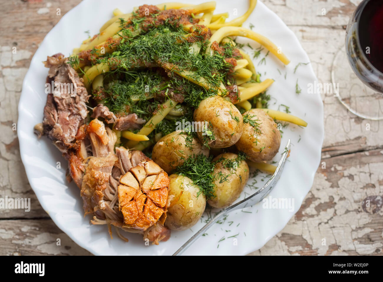 Roast pork with green beans & baby potatoes Stock Photo Alamy