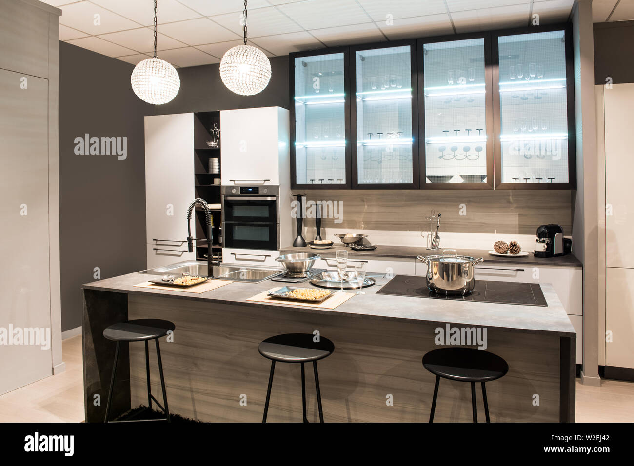 Modern Kitchen With Center Island And Bar Stools With Modern