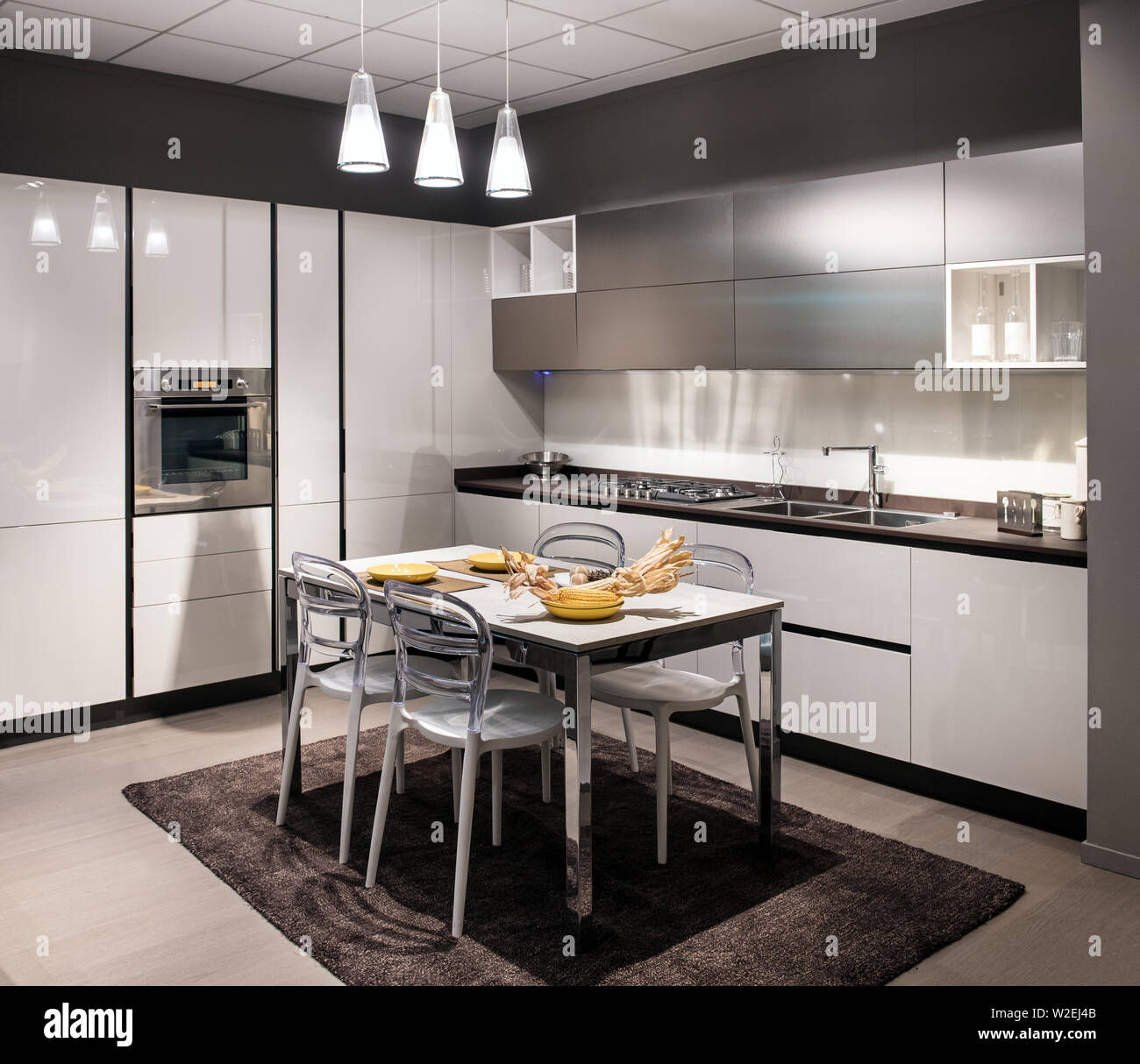 Modern electric cooking appliances and built in cabinets inside kitchen of  home Stock Photo - Alamy