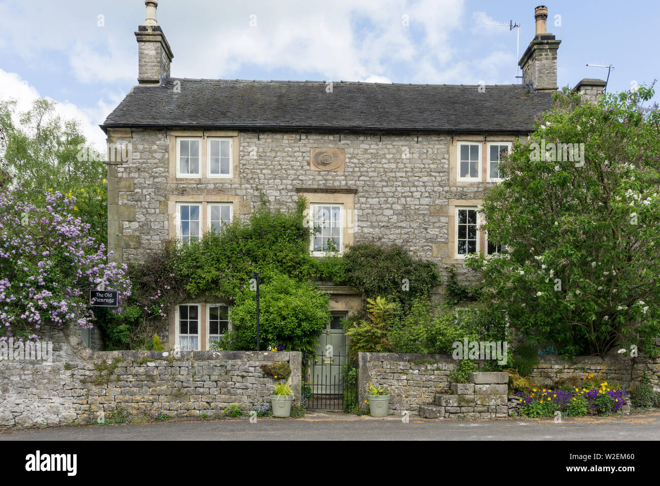 The Old Vicarage, a period property, in the Peak District village of Hartington, Derbyshire, UK Stock Photo