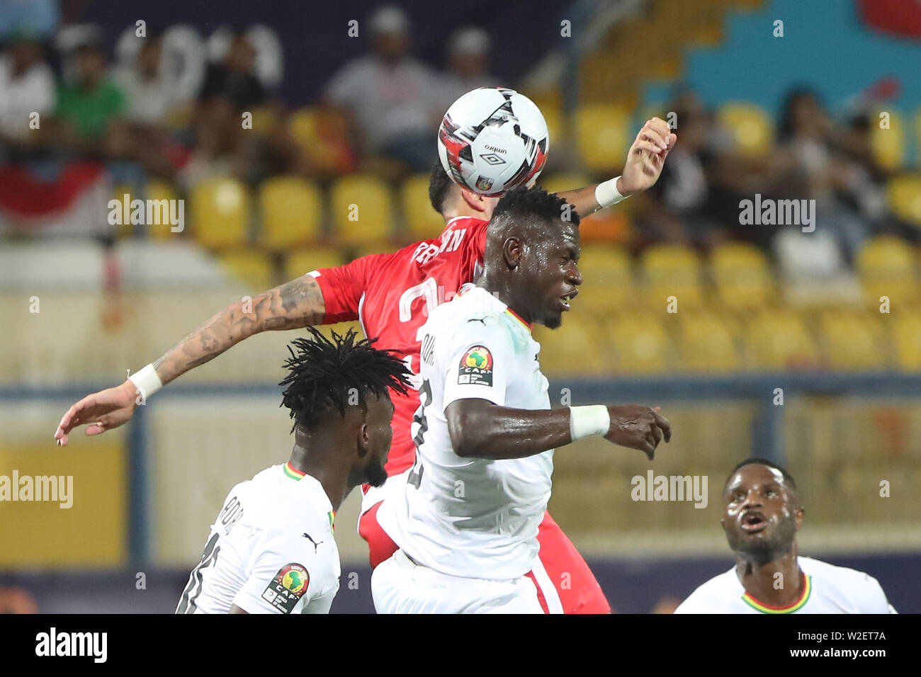 Ismailia, Egypt. 08th July, 2019. Ghana·s Jonathan Mensah (C) and Tunisia·s Dylan Bronn battle for the ball during the 2019 Africa Cup of Nations round of 16 soccer match between Ghana and Tunisia at the Ismailia Stadium. Credit: Gehad Hamdy/dpa/Alamy Live News Stock Photo