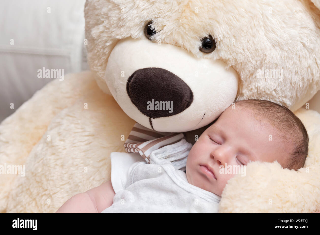 Sleeping boy holding teddy bear hi-res stock photography and images - Alamy
