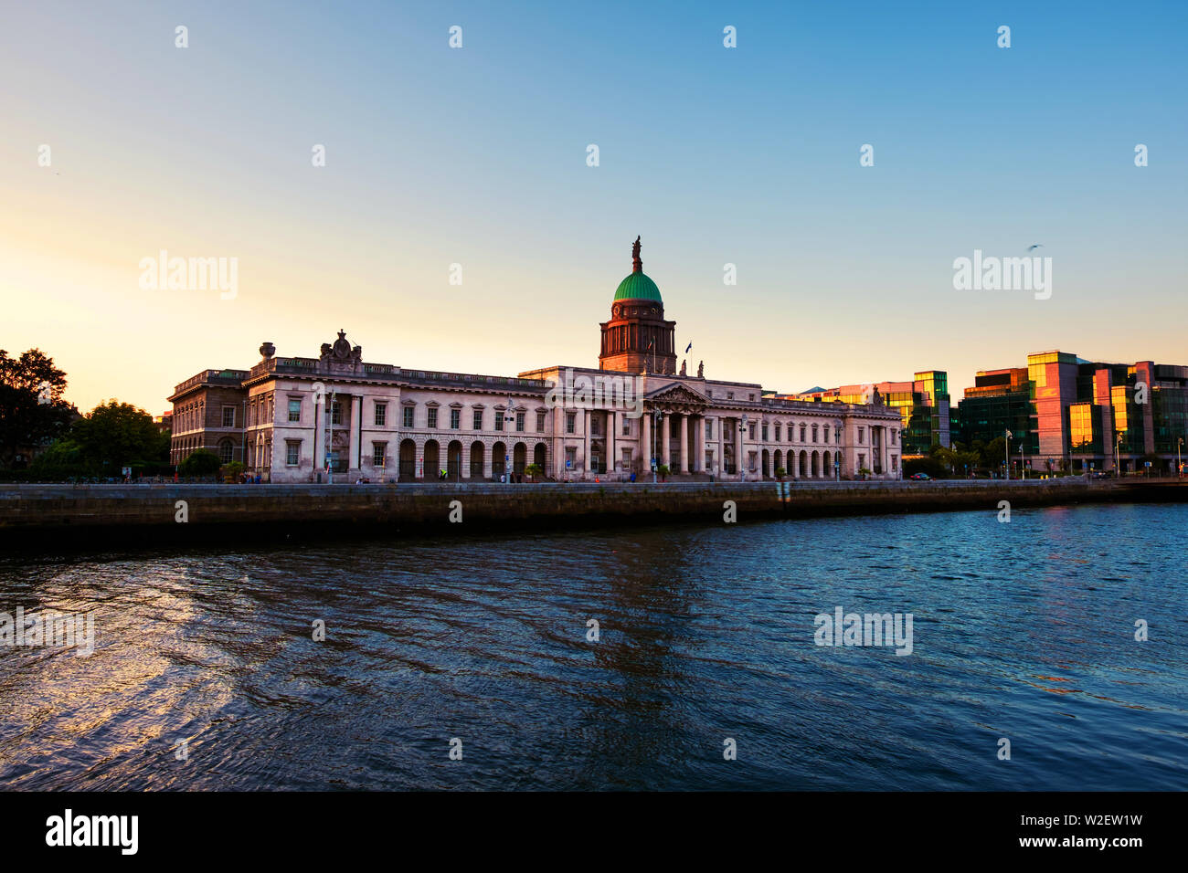 Dublin, Ireland. The Custom house in Dublin, Ireland in the evening at sunset. Clear colorful sky Stock Photo