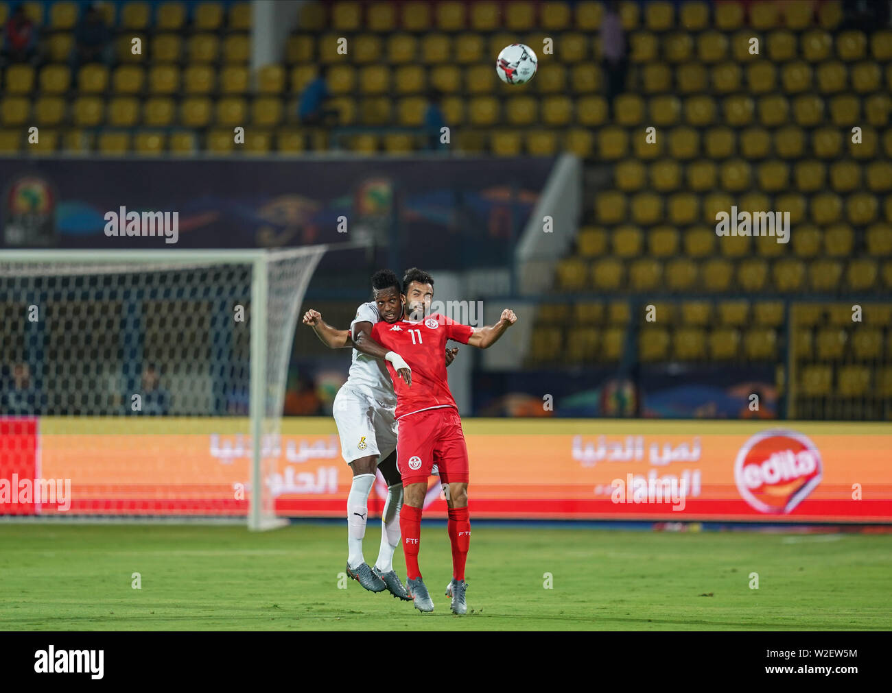 FRANCE OUT July 8, 2019: Jonathan Mensah of Ghana and Taha Yassine Khnissi of Tunisia challenging for the ball during the 2019 African Cup of Nations match between Ghana and Tunisia at the Ismailia Stadium in Ismailia, Egypt. Ulrik Pedersen/CSM. Stock Photo