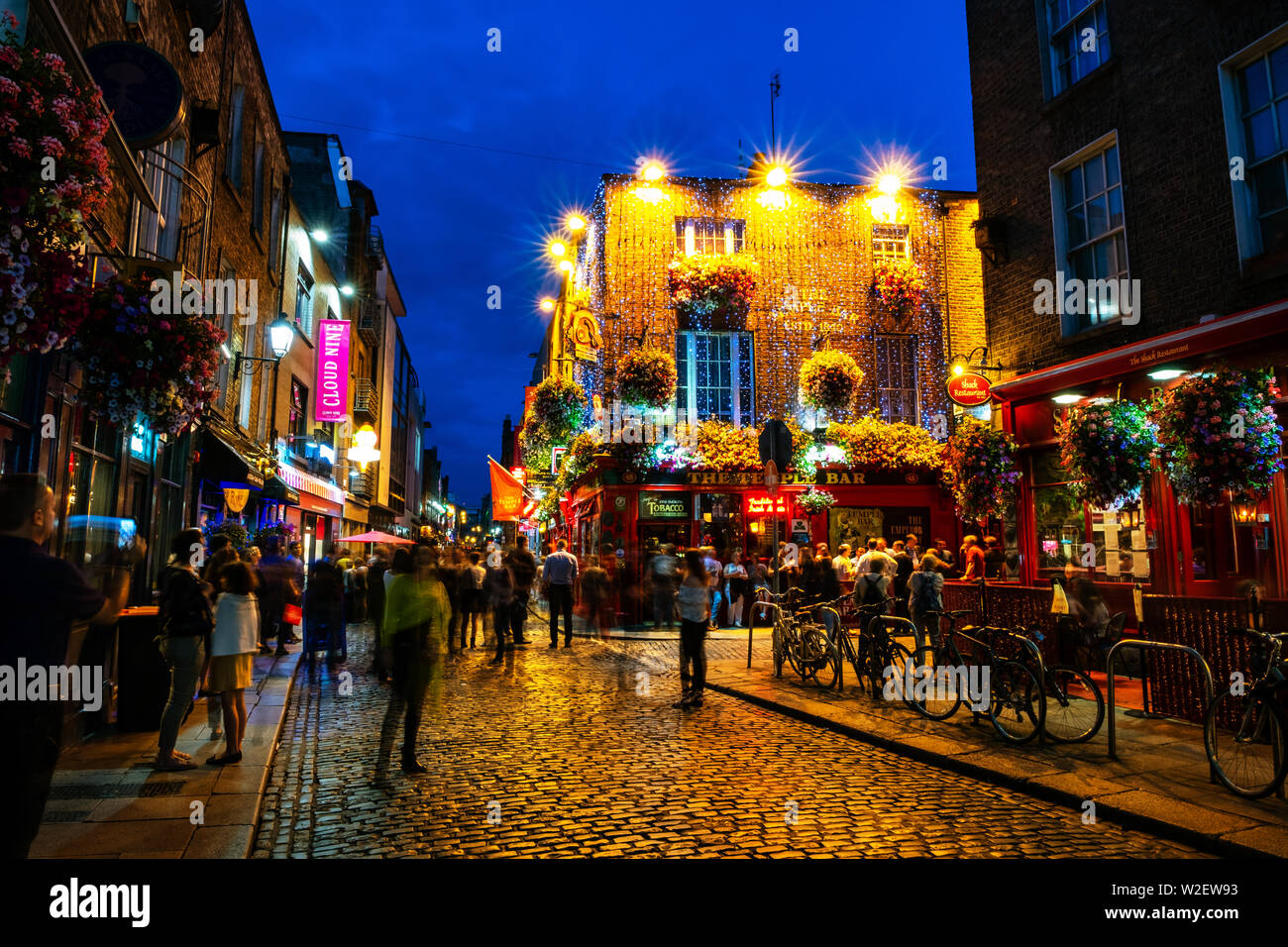 DUBLIN, IRELAND - JULY 19, 2017: Nightlife at popular historical part of the city - Temple Bar quarter in Dublin, Ireland. The area is the location of Stock Photo