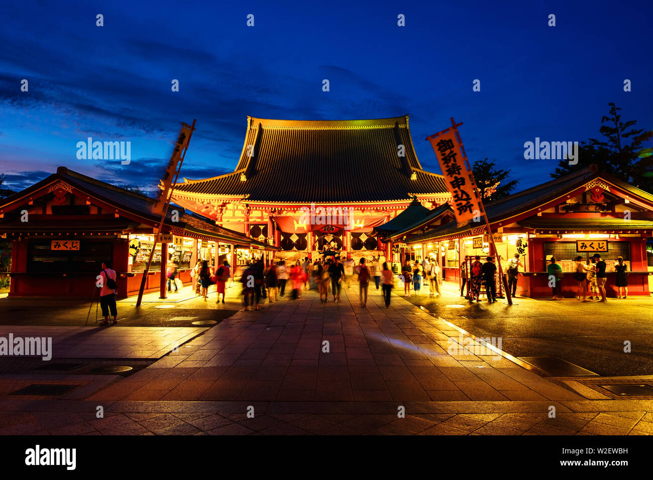 TOKYO, JAPAN - AUGUST 6, 2018: Senso - ji Buddhist temple is the oldest temple in Tokyo, Japan. Night view with colorful sunset sky. People visiting t Stock Photo