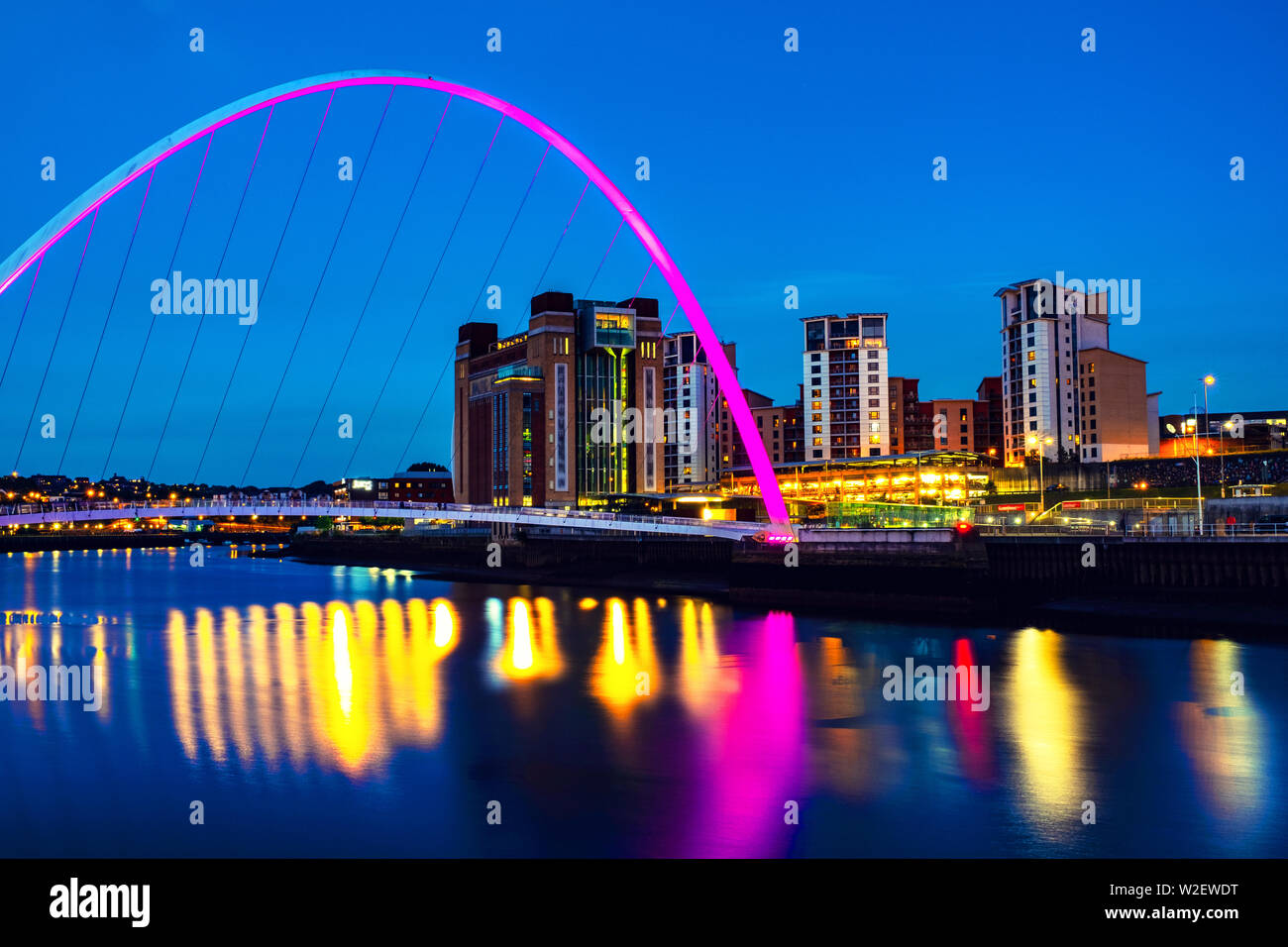Newcastle upon Tyne, UK. Famous Millennium bridge at night. Illuminated
