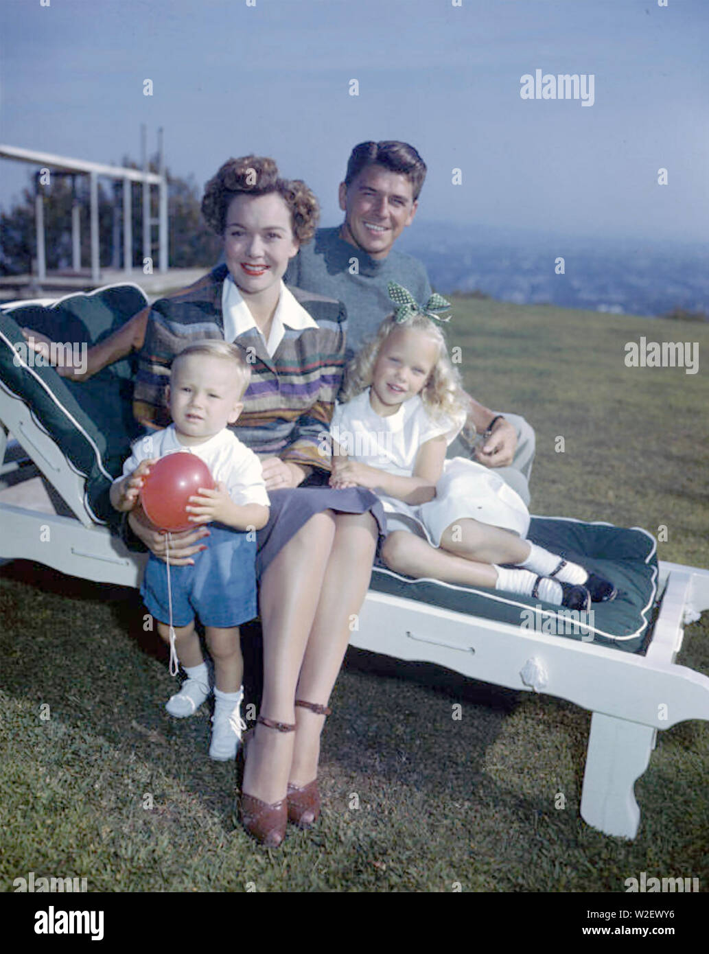 RONALD REAGAN (1911-2004) American film actor and later President with his first wife Jane Wyman and their children Maureen and Michael about 1946 Stock Photo