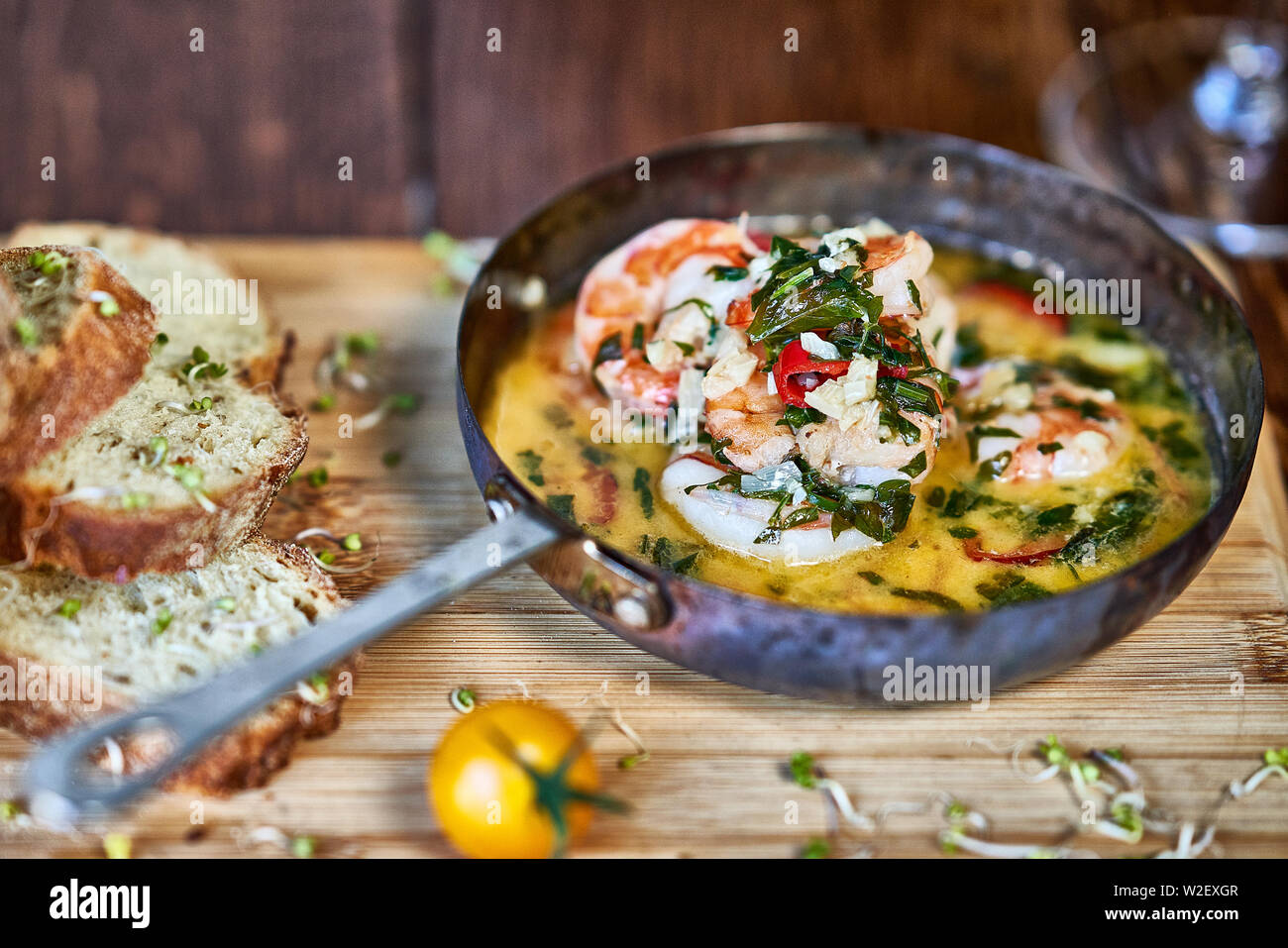 Spicy garlic chilli Prawns Shrimps on frying pan with lemon and
