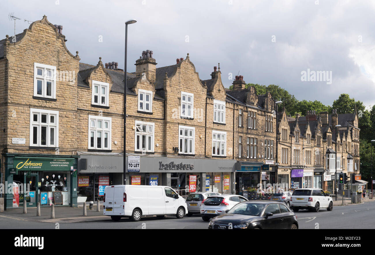 Row of stone built shops forming Oakwood Parade on Roundhay Road, Oakwood, Leeds, Yorkshire, England, UK Stock Photo