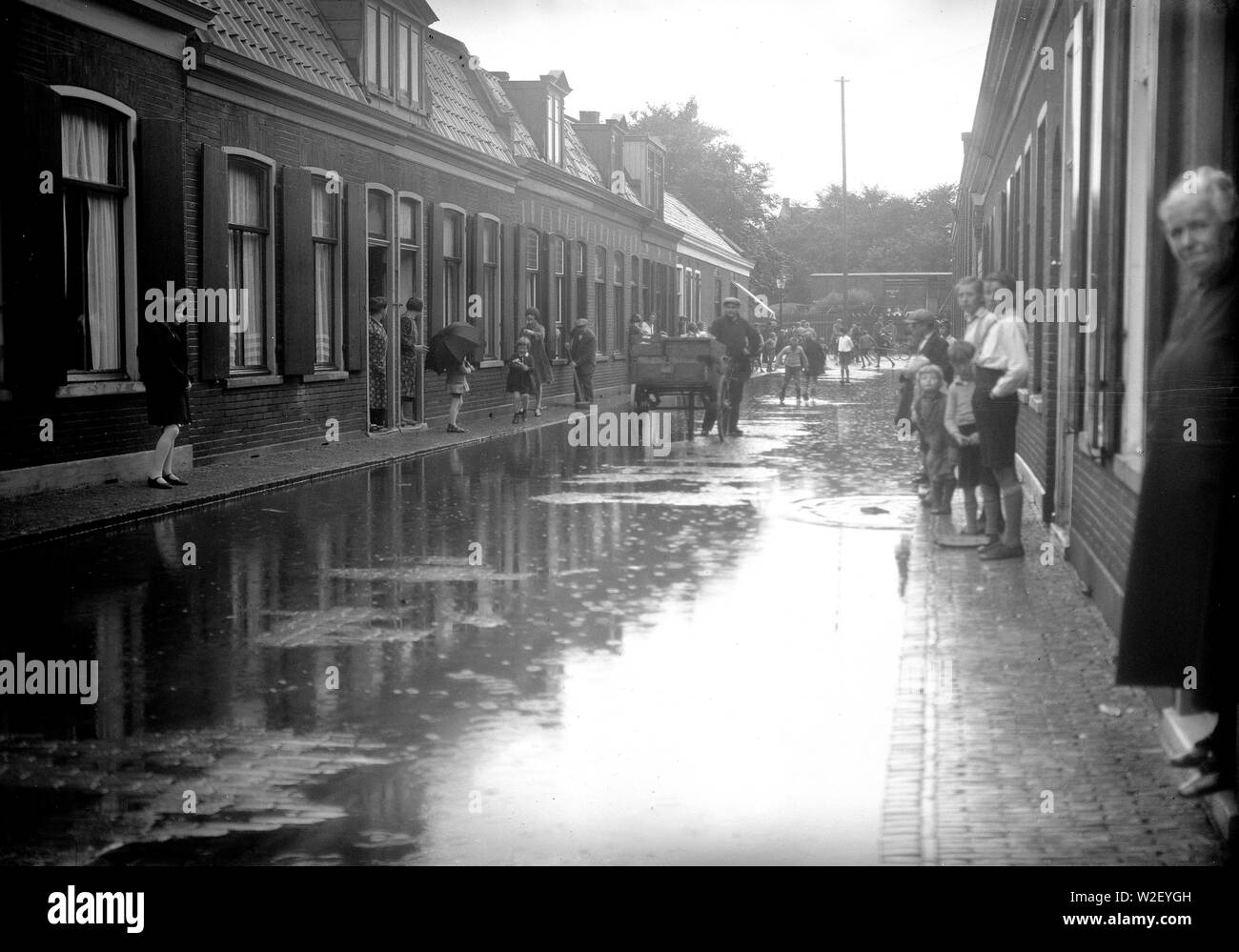 Netherlands history - street scene in a city in the Netherlands after a rain ca. 1930 Stock Photo
