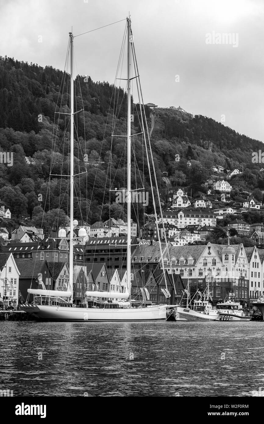 Sail yacht Kamaxitha visiting the port of Bergen, Norway. Bryggen UNESCO world heritage quay. Veteran fishing boat Orient, now a pleasure boat. Stock Photo