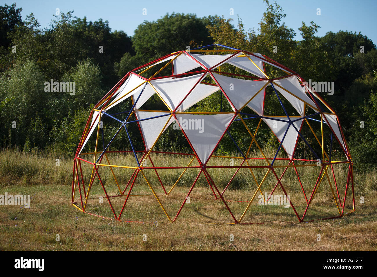Semispherical design with fabric awnings for relaxing in a meadow near the forest Stock Photo